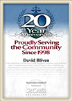 David Bliven received proudly serving the community since 1998 badge for 20 years